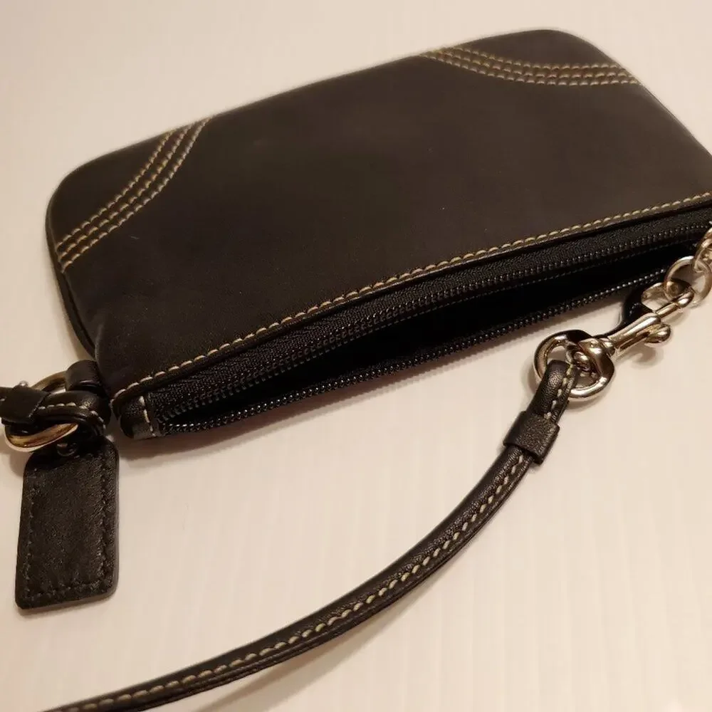 Black leather coach wristlet. Pre-owned, perfect shape. Size 6.5